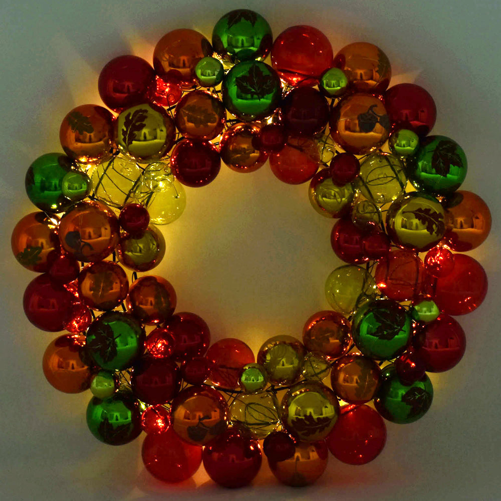 Temp-tations 16" Shatterproof Ornament Wreath in Harvest with fairly lights turned on