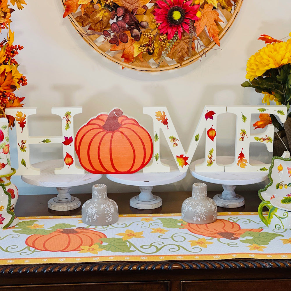 temp-tations wooden "HOME" letters sign on a fall-themed buffet table