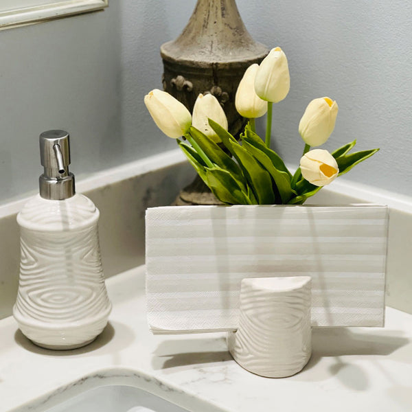 Temp-tations Essentials Soap Dispenser & Sponge Holder in Woodland White with flowers and towels on a bathroom sink